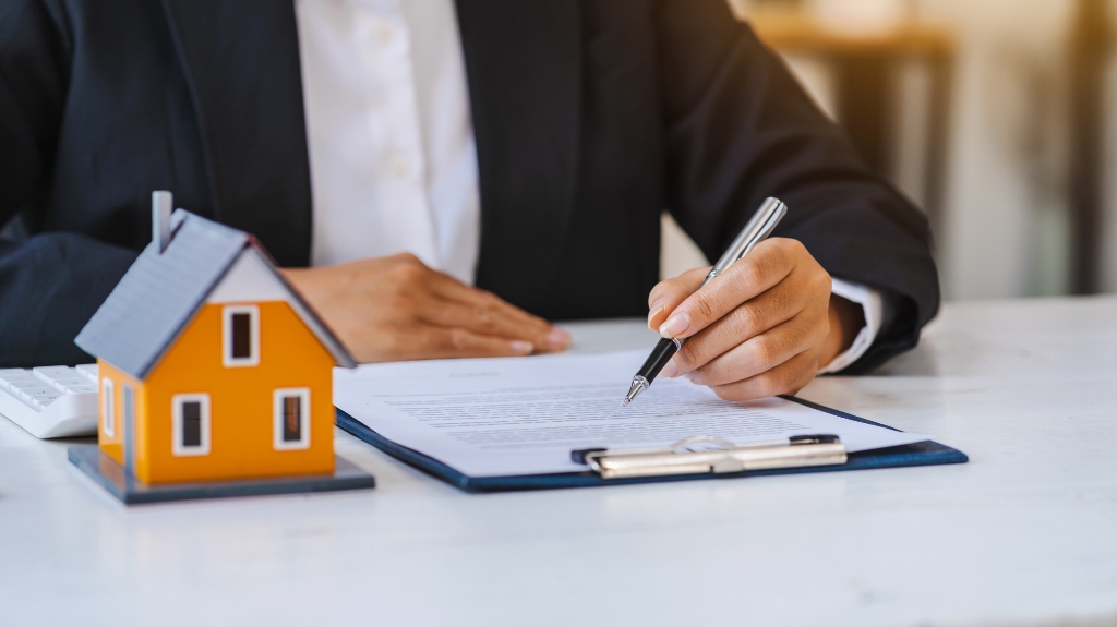 Real estate lawyer working on document for house